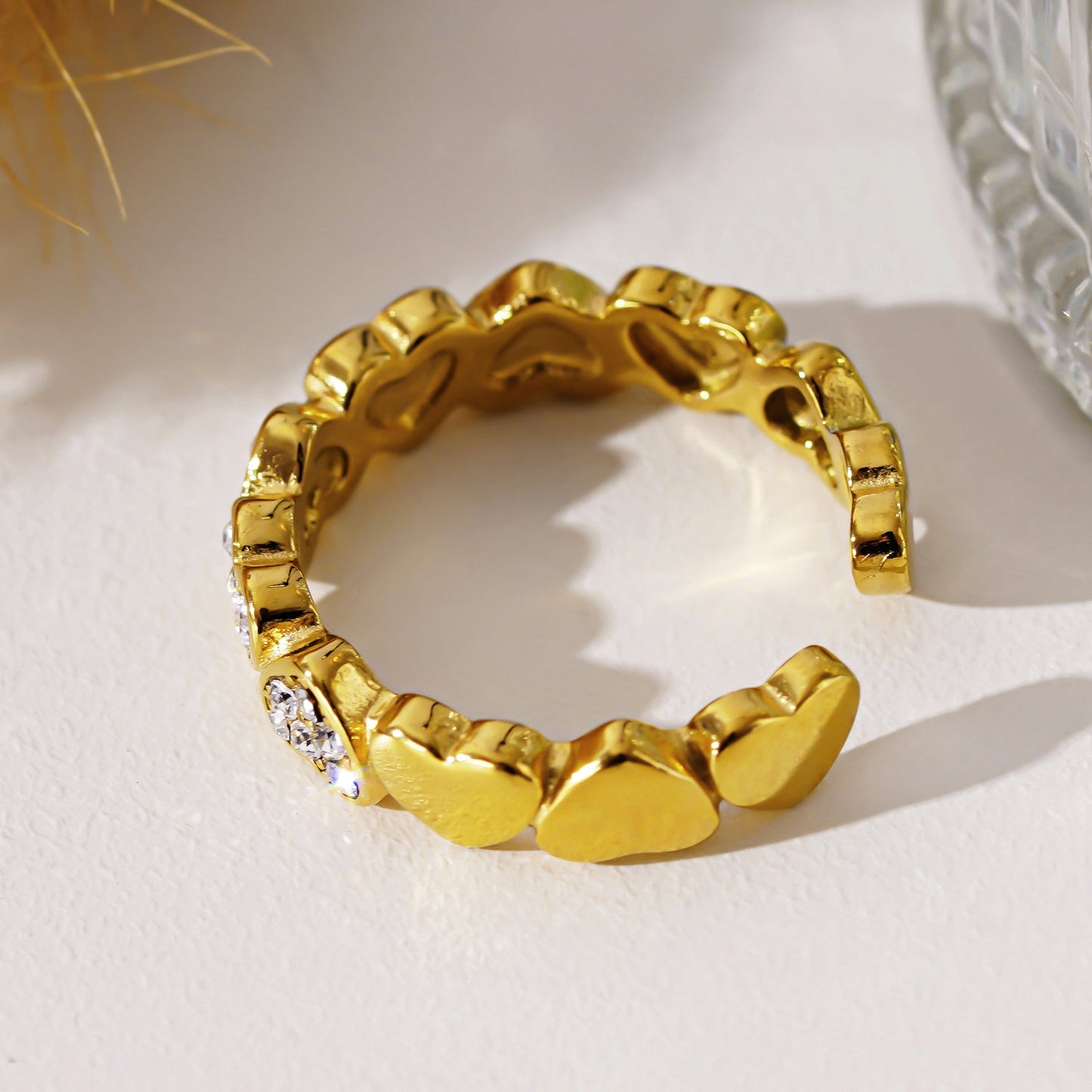 JEZREEL: Heart-Shaped Mini Charms Encircled Ring With Zirconia Crystal Centre Pieces
